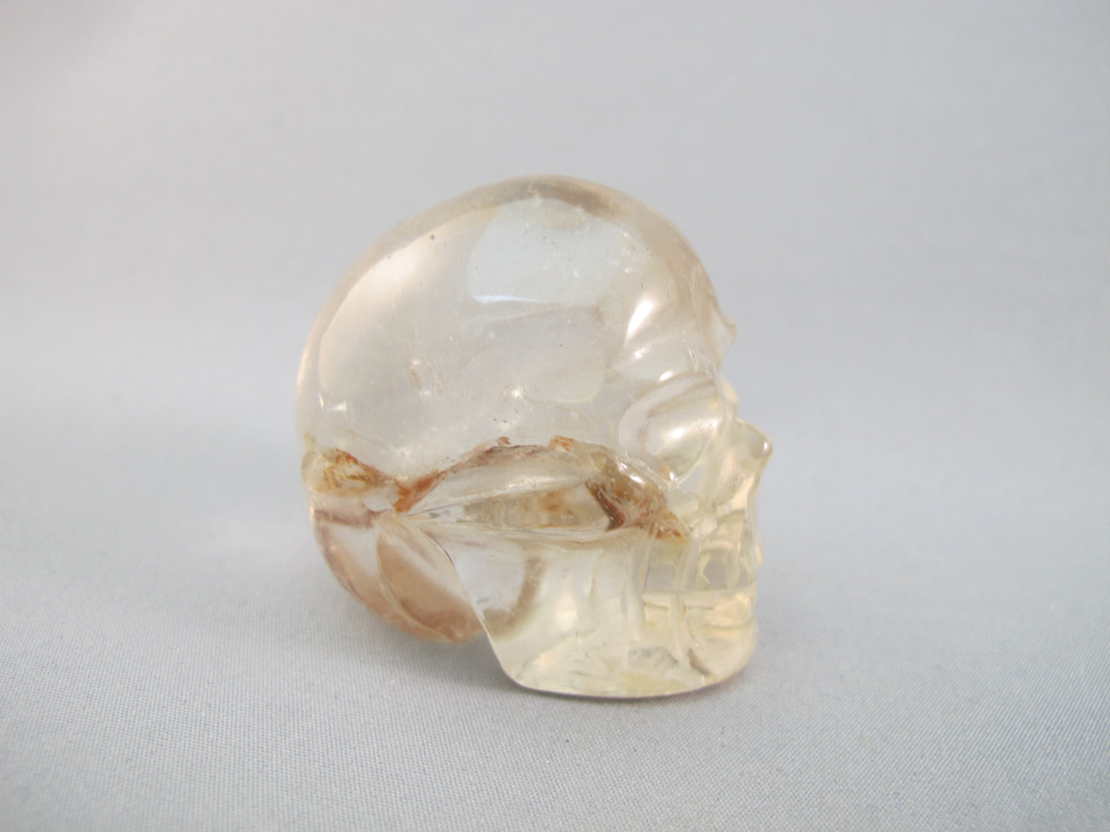 A-Q-S-83 :  Adoption 1.8-Inch Hematoid Quartz Crystal Skull