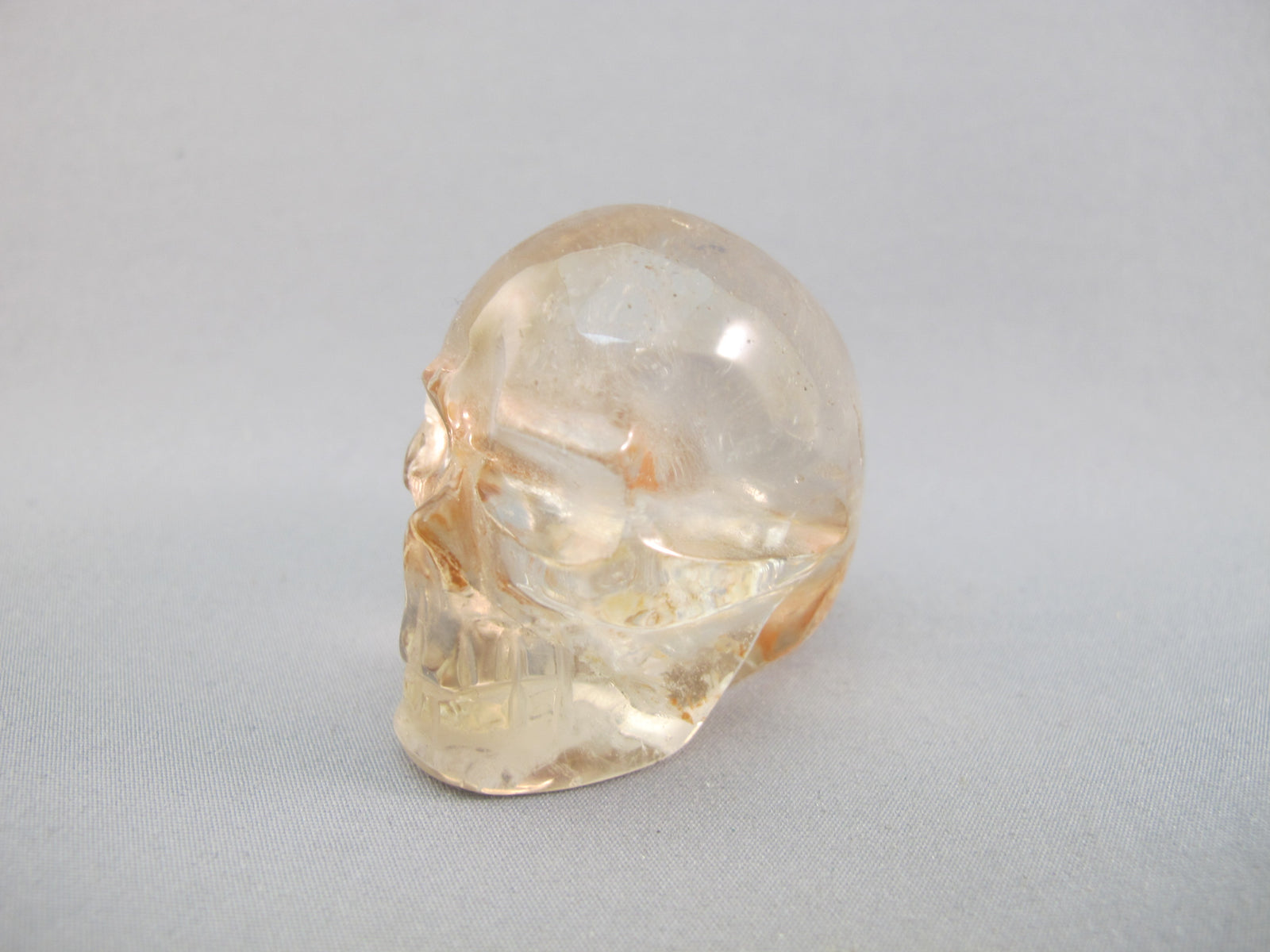 A-Q-S-83 :  Adoption 1.8-Inch Hematoid Quartz Crystal Skull