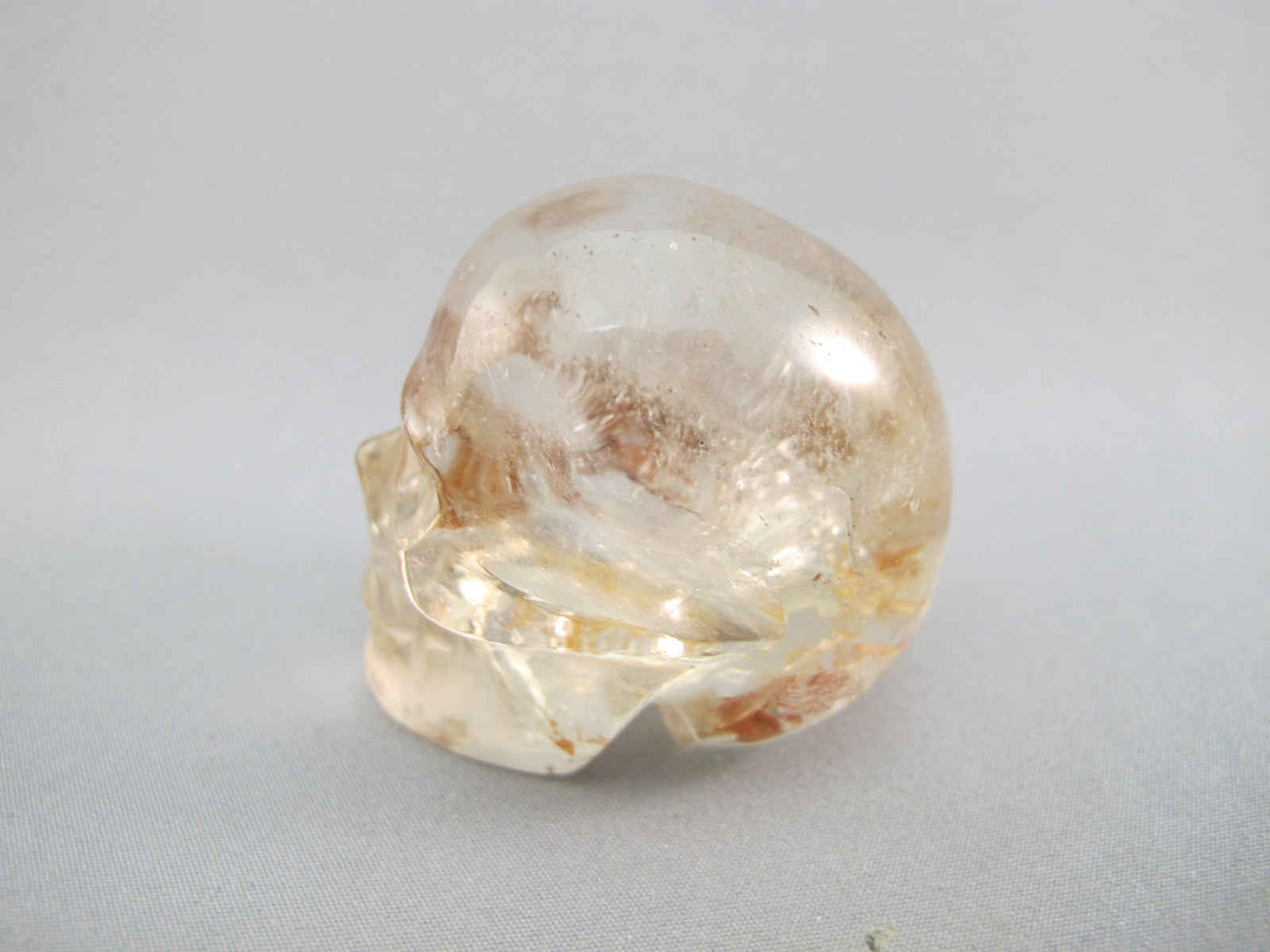 A-Q-S-83 :  Adoption 1.8-Inch Hematoid Quartz Crystal Skull
