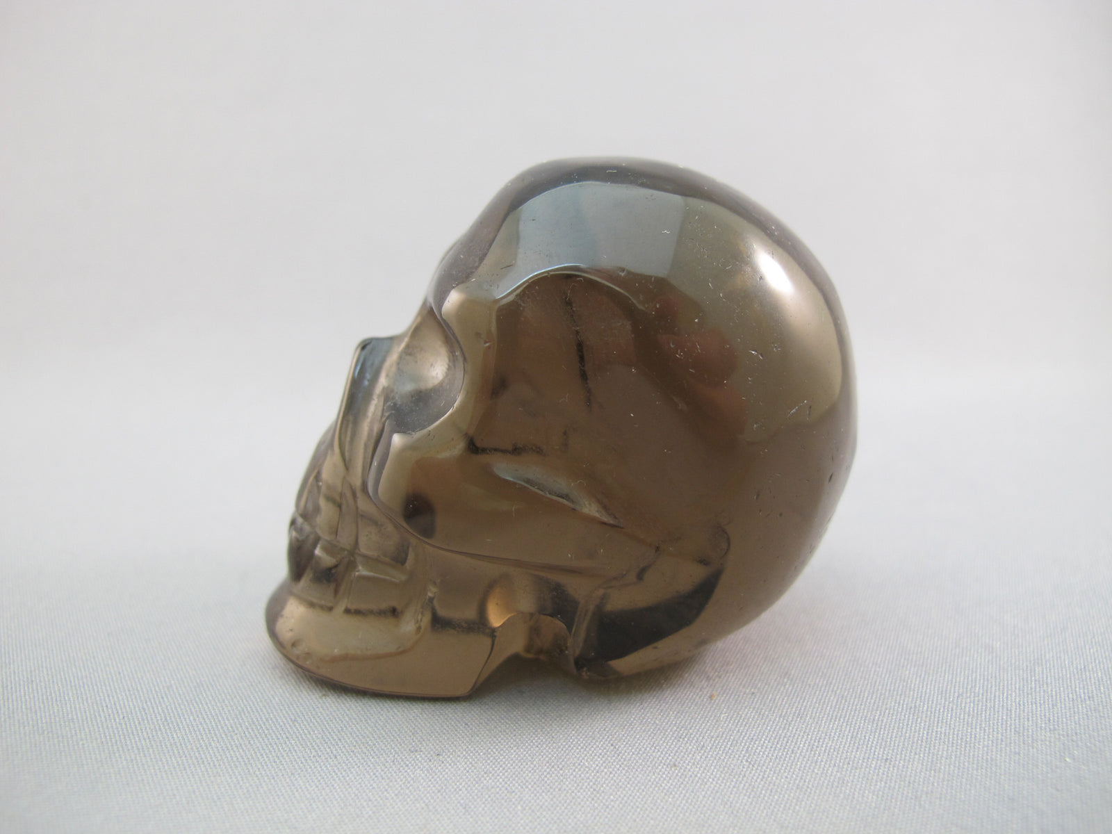 A-ASC-SQ-M-111 :  Adoption 2.1-Inch  Ascension Smoky Quartz Crystal Skull