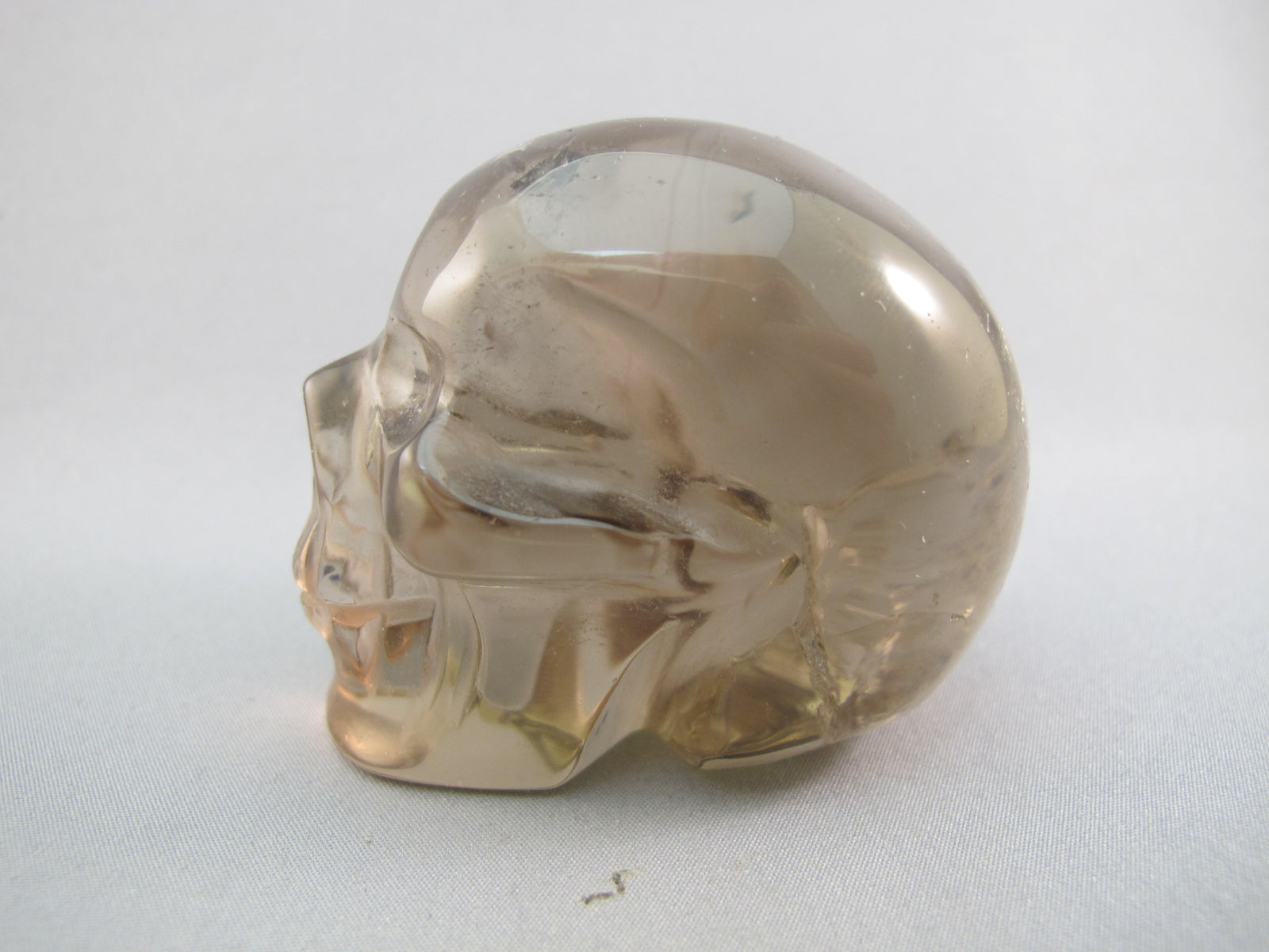 A-SQ-M-177-r : Adoption 2.4-Inch Rainbow Smoky Quartz Crystal Skull