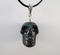 D-LP-N -g : Gold-Flash Nuummite Crystal Skull Pendant