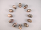 CS-12-RH-15 : Rhodonite 12 Crystal Skulls Set