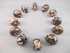 CS-12-RH-15 : Rhodonite 12 Crystal Skulls Set