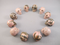 CS-12-RH-15-p : Shades of Pink Rhodonite 12 Crystal Skulls Set