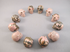 CS-12-RH-15-p : Shades of Pink Rhodonite 12 Crystal Skulls Set