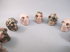 CS-12-RH-15-p : Shades of Pink Rhodonite 12 Crystal Skulls Set