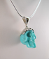 J-SS-T-7.6-s : Scrolled Sterling Silver Turquoise Crystal Skull Pendant