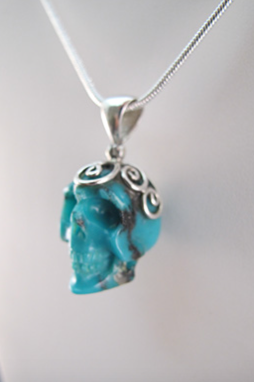 J-SS-T-10.5-s : Scrolled Sterling Silver Campitos Turquoise Crystal Skull Pendant