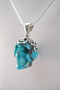 J-SS-T-10.5-s : Scrolled Sterling Silver Campitos Turquoise Crystal Skull Pendant