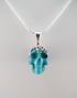 J-SS-T-10.5-s : Scrolled Sterling Silver Campitos Turquoise Crystal Skull Pendant