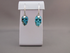 J-SS-T-14.8-e : Sterling Silver Gem Turquoise Crystal Skull Earrings