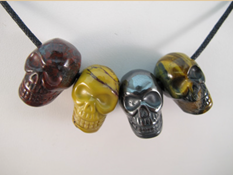 J-CS-4-MS-2-RJMHTE : Multi-Stone Crystal Skull Pendant Set of 4 RED JASPER / MOOKAITE / HEMATITE / TIGER EYE