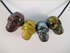 J-CS-4-MS-2-RJMHTE : Multi-Stone Crystal Skull Pendant Set of 4 RED JASPER / MOOKAITE / HEMATITE / TIGER EYE